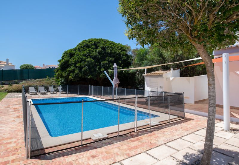 Child Playing Near Fence